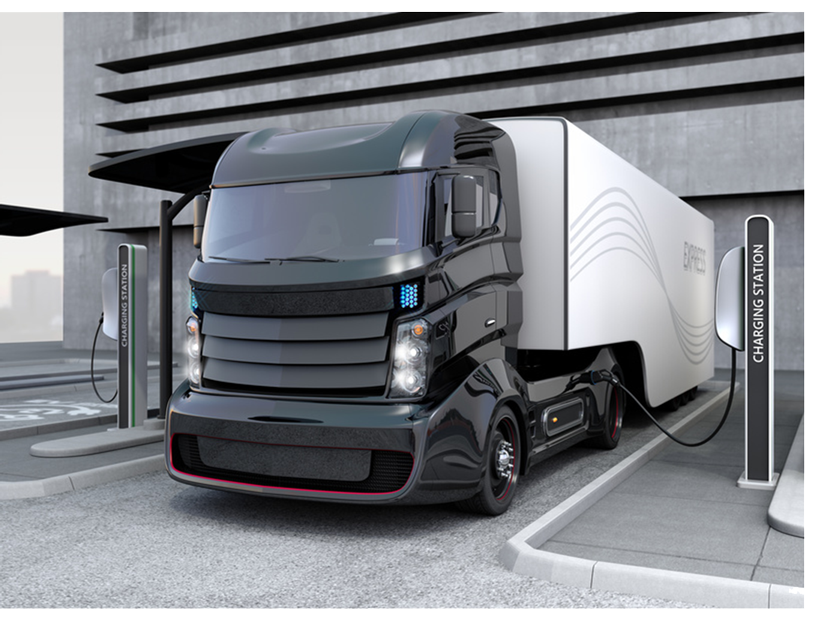 Hybrid-electric-truck-being-charging-at-charging-station-